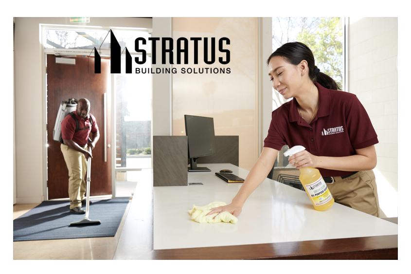 Side-by-Side Images of a Stratus Employee Vacuuming a Floor Mat and a Stratus Employee with a Spray Bottle Wiping a Desk 
